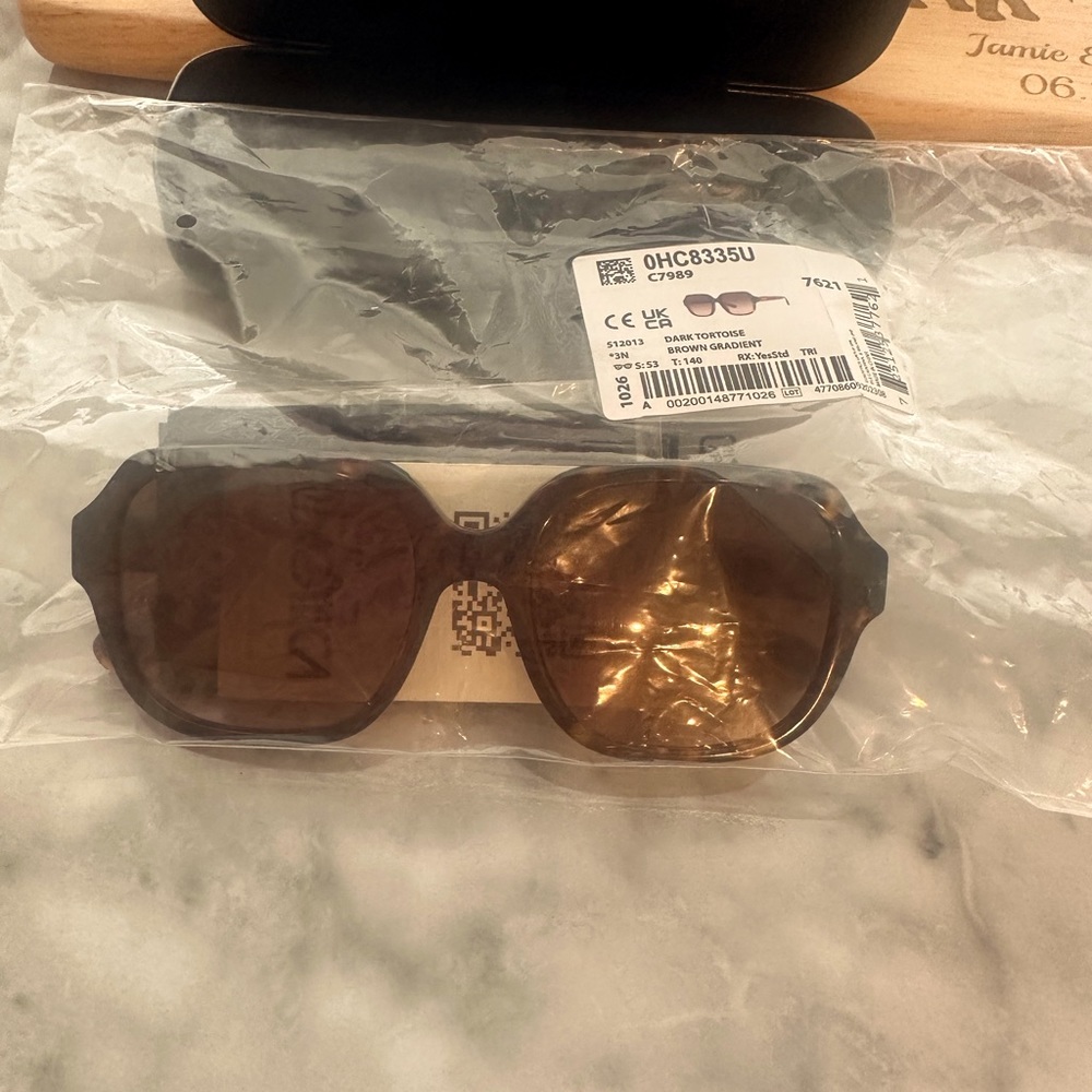 Brand new in package (never worn) Coach sunglasses.